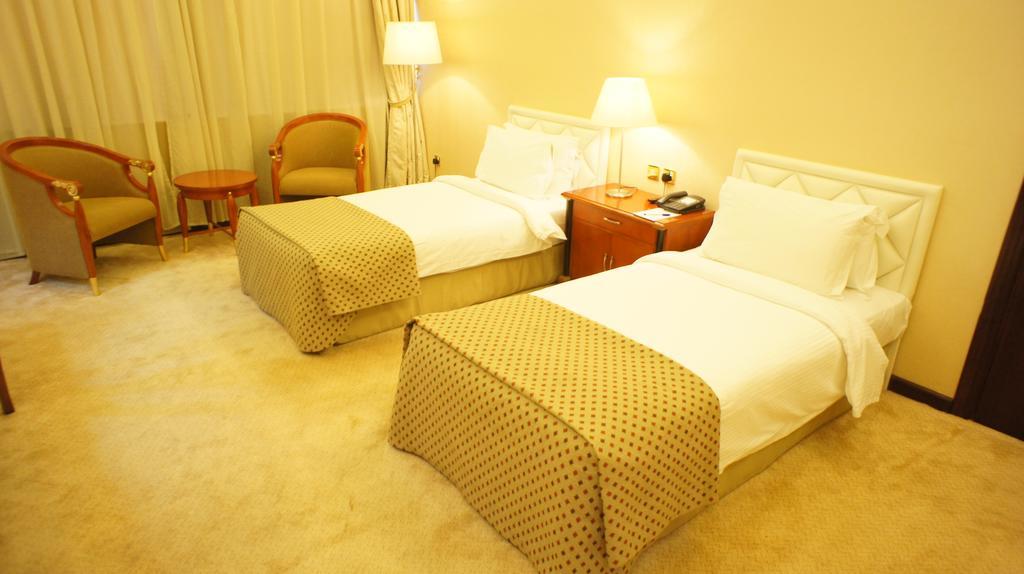 Gloria Hotel Doha Quarto foto